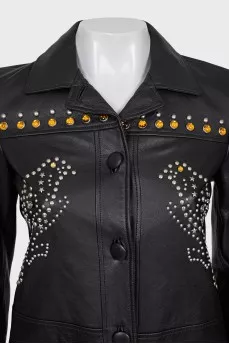 Leather jacket decorated with rivets and crystals