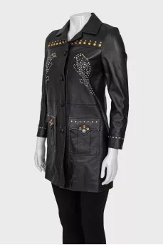 Leather jacket decorated with rivets and crystals
