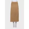 A top and skirt suit with gold thread