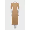A top and skirt suit with gold thread