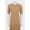 A top and skirt suit with gold thread
