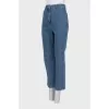 Blue straight-leg jeans with a button