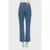 Blue straight-leg jeans with a button