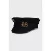 Wool cap with metal decoration