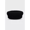 Wool cap with metal decoration