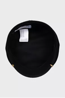 Wool cap with metal decoration