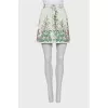 Denim mini skirt decorated with embroidery
