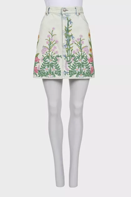 Denim mini skirt decorated with embroidery