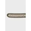 Leather belt decorated with eyelets