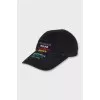 Cap decorated with branded embroidery