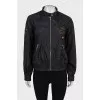 Jacket with a zipper and a patch