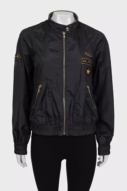 Jacket with a zipper and a patch