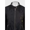 Jacket with a zipper and a patch