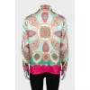 Silk shirt with a bright print and tag