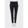 Wool trousers with zippers at the bottom