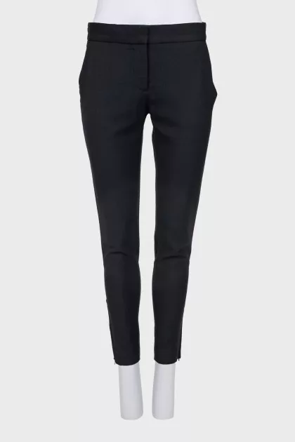 Wool trousers with zippers at the bottom