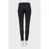 Wool trousers with zippers at the bottom
