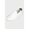 White textile slip-ons