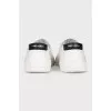 White textile slip-ons
