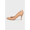 Patent leather shoes with gold heels