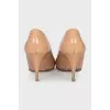 Patent leather shoes with gold heels