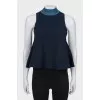 Sleeveless top with a high collar