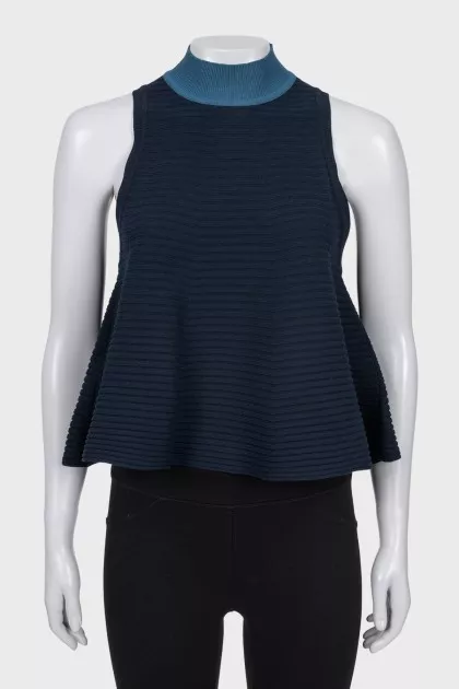 Sleeveless top with a high collar