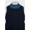 Sleeveless top with a high collar