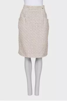 Suit consisting of a jacket and skirt with pockets