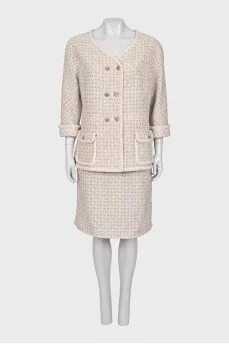 Suit consisting of a jacket and skirt with pockets
