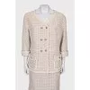 Suit consisting of a jacket and skirt with pockets
