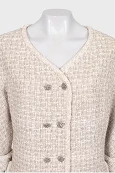 Suit consisting of a jacket and skirt with pockets