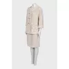 Suit consisting of a jacket and skirt with pockets
