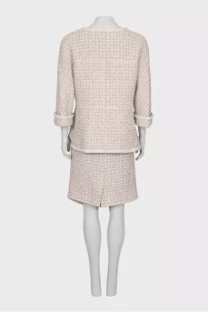 Suit consisting of a jacket and skirt with pockets