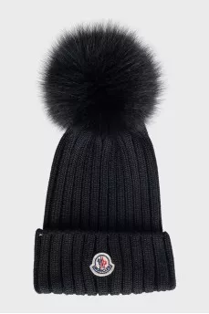 Black hat with a pompom