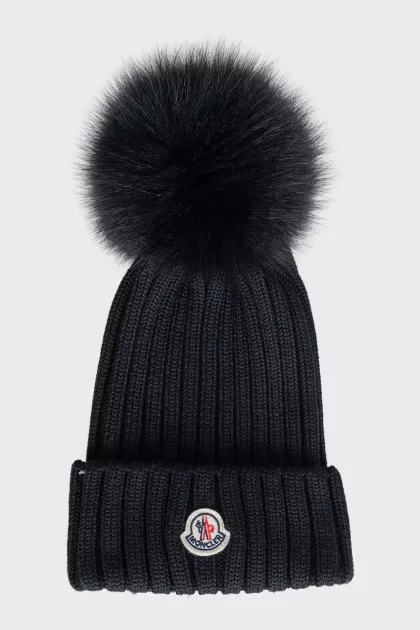Black hat with a pompom