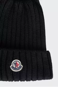 Black hat with a pompom