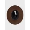 Suede hat decorated with feathers