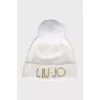 White hat with a golden logo