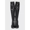 Black leather over-the-knee boots