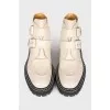 Leather boots with straps and buckles