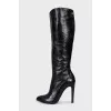 Black leather boots with pointed toes
