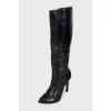 Black leather boots with pointed toes