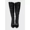Black leather boots with pointed toes