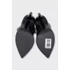 Black leather boots with pointed toes