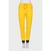 Sports yellow trousers with stripes