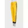Sports yellow trousers with stripes