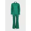 Suit with a silk blouse with a tag