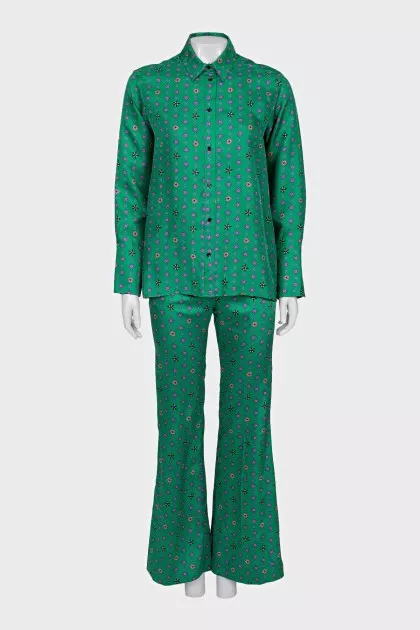 Suit with a silk blouse with a tag
