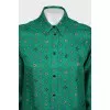 Suit with a silk blouse with a tag